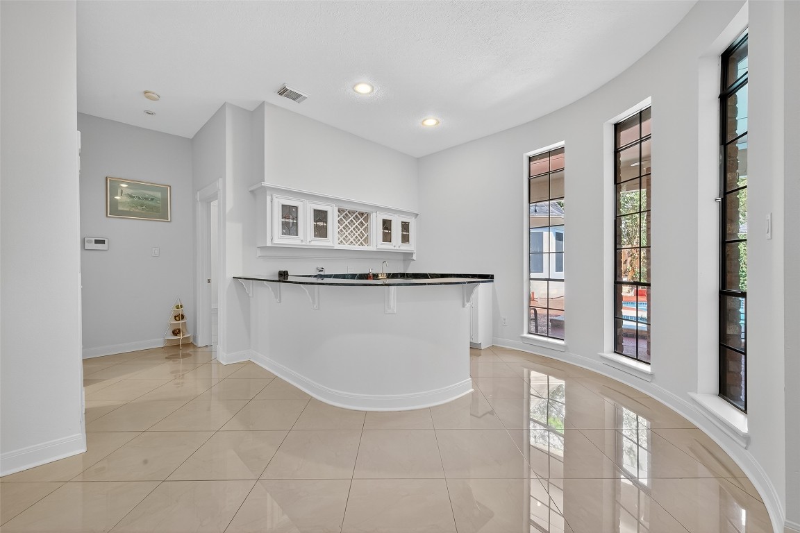 17318 Rothko Lane Spring, TX 77379 - Photo 10 of 46 a view of kitchen with granite countertop cabinets and window