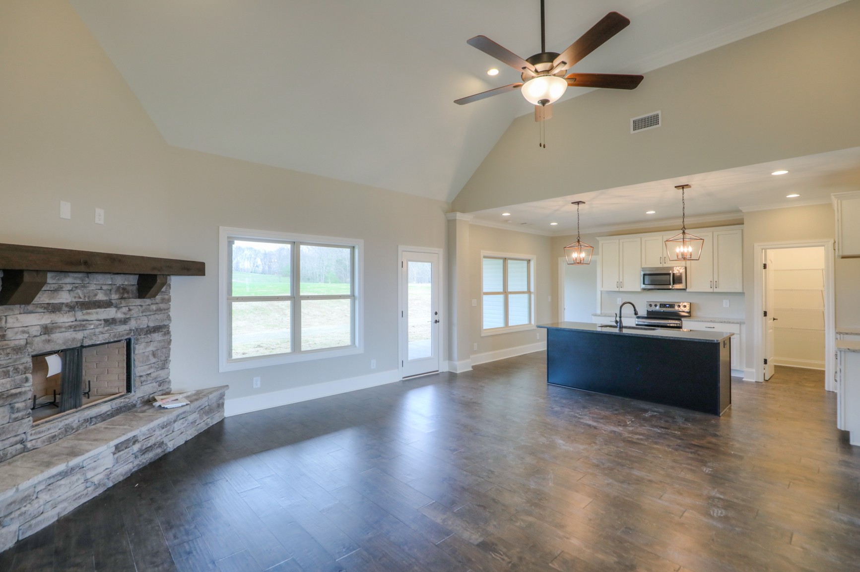 2365 Belotes Ferry Road Lebanon, TN 37087 - Photo 15 of 35 a large living room with a large window and a fireplace