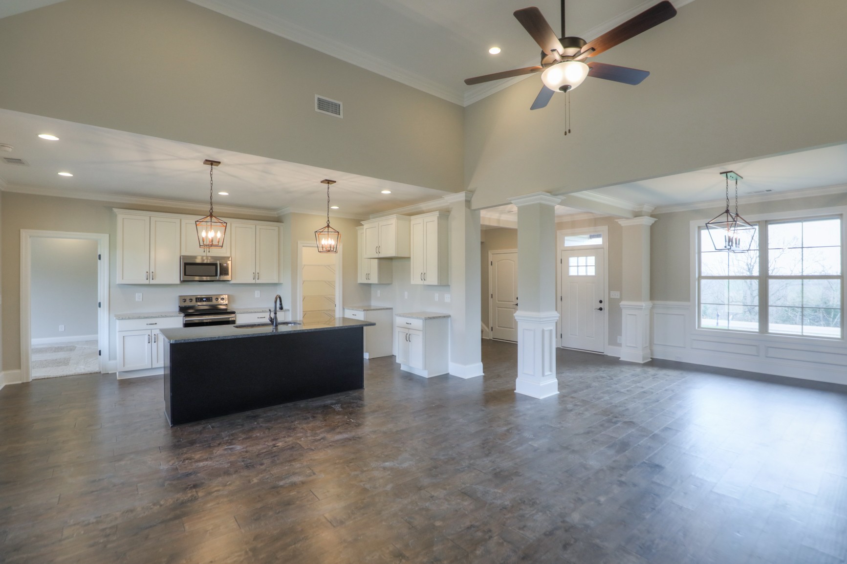 2365 Belotes Ferry Road Lebanon, TN 37087 - Photo 17 of 35 a large open kitchen with a large window a refrigerator and a fireplace