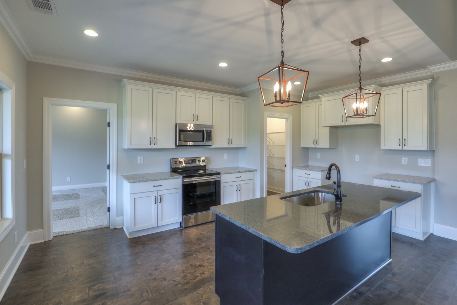 2365 Belotes Ferry Road Lebanon, TN 37087 - Photo 18 of 35 a kitchen with stainless steel appliances granite countertop a sink a stove and a refrigerator