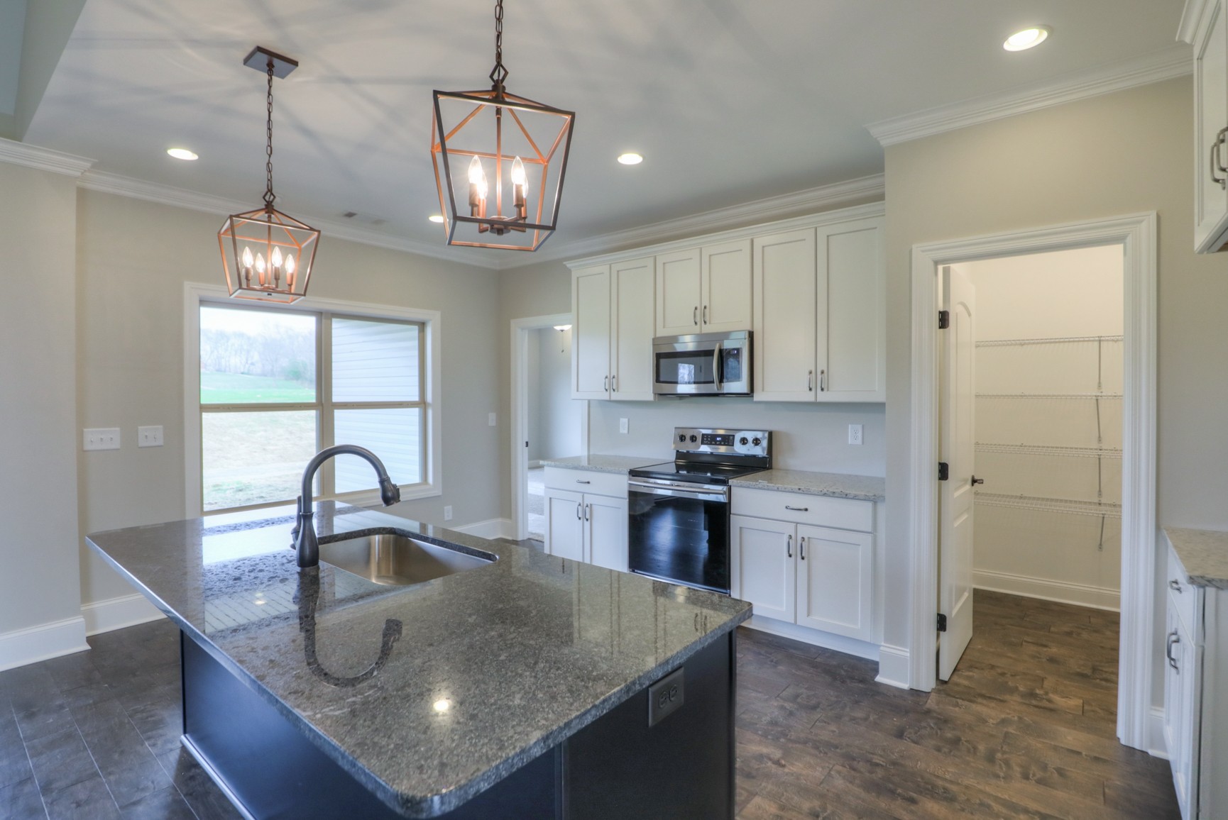 2365 Belotes Ferry Road Lebanon, TN 37087 - Photo 21 of 35 a kitchen with stainless steel appliances granite countertop a sink a stove and refrigerator