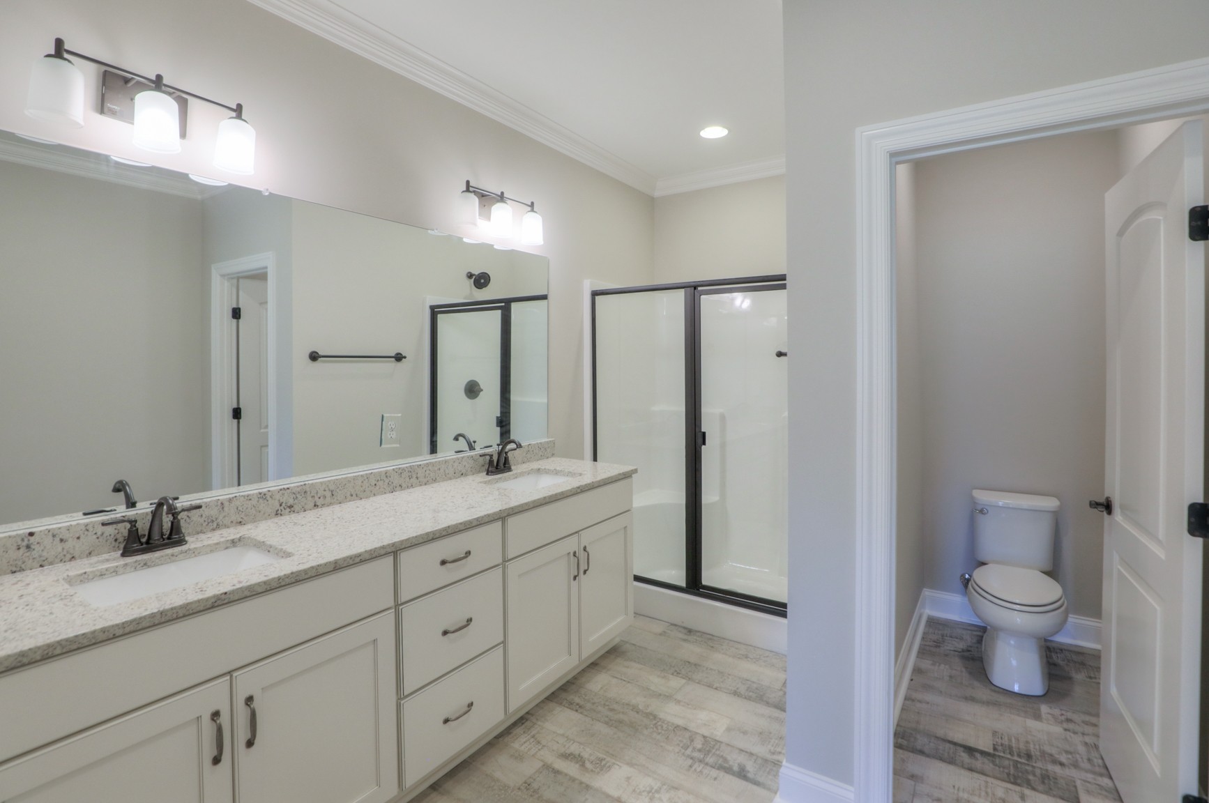 2365 Belotes Ferry Road Lebanon, TN 37087 - Photo 24 of 35 a spacious bathroom with a granite countertop sink a toilet and a mirror