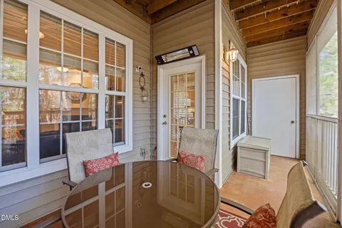 a front view of a house with outdoor seating