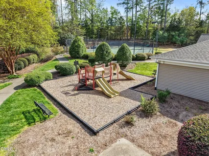 a view of a backyard with sitting area