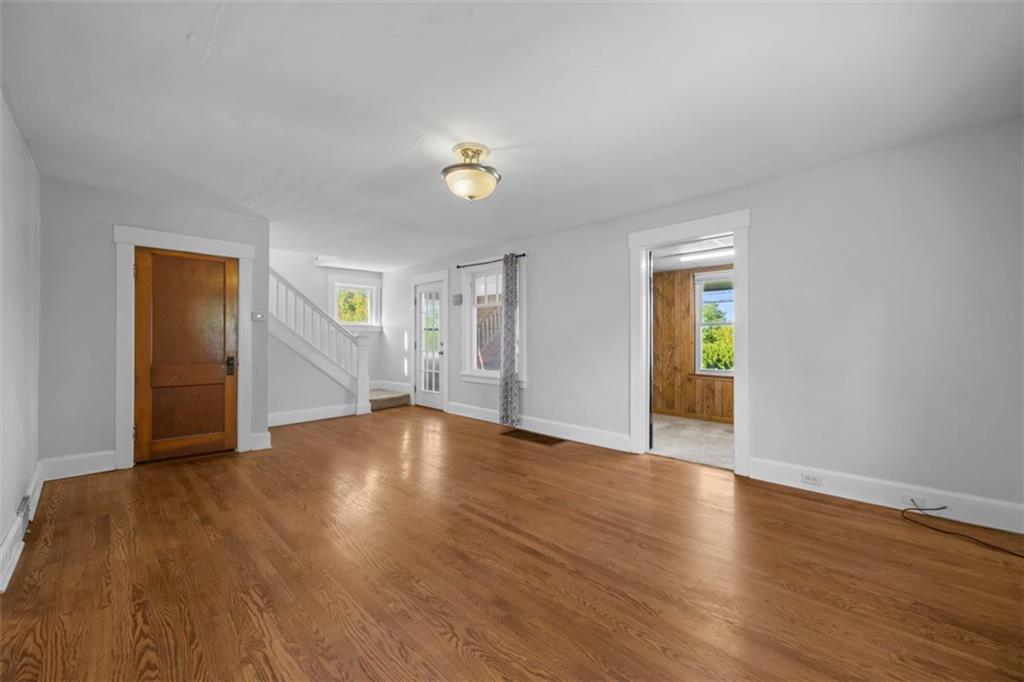 464 Franklin Street Slippery Rock, PA 16057 - Photo 15 of 45 a view of an empty room with wooden floor and a window