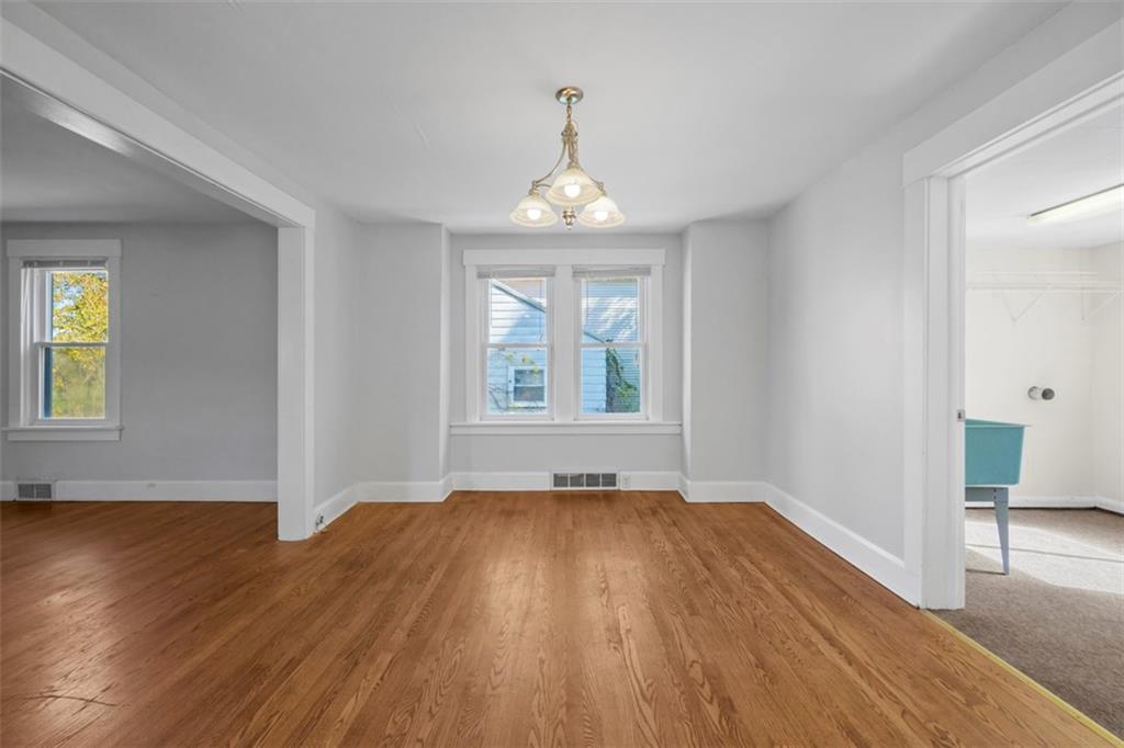 464 Franklin Street Slippery Rock, PA 16057 - Photo 20 of 45 wooden floor in an empty room with a window