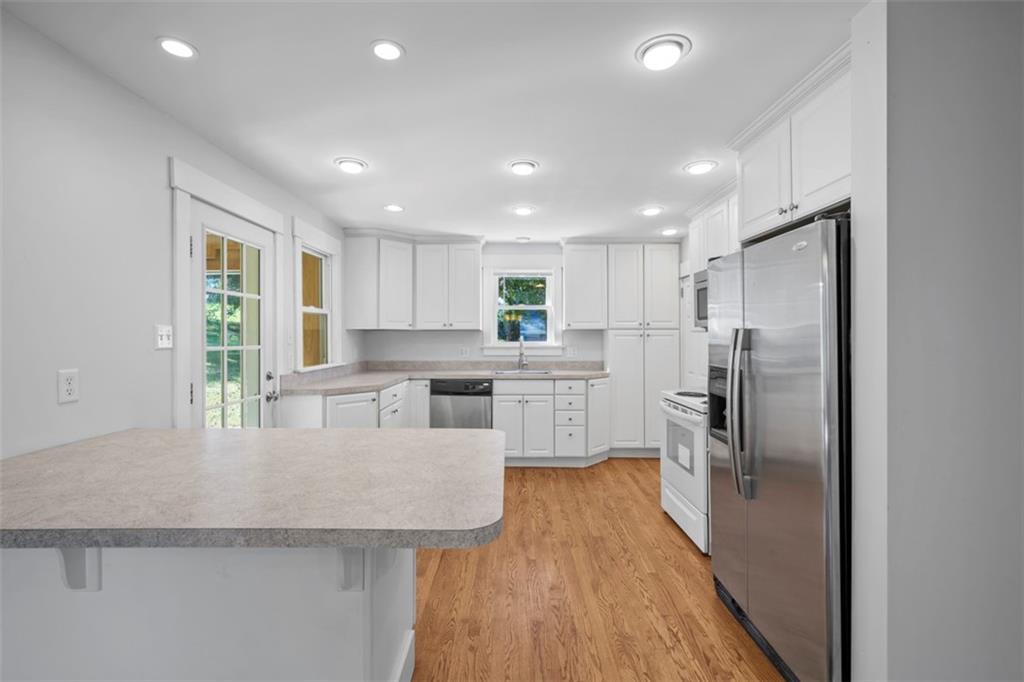 464 Franklin Street Slippery Rock, PA 16057 - Photo 24 of 45 a kitchen with stainless steel appliances granite countertop a refrigerator sink and stove
