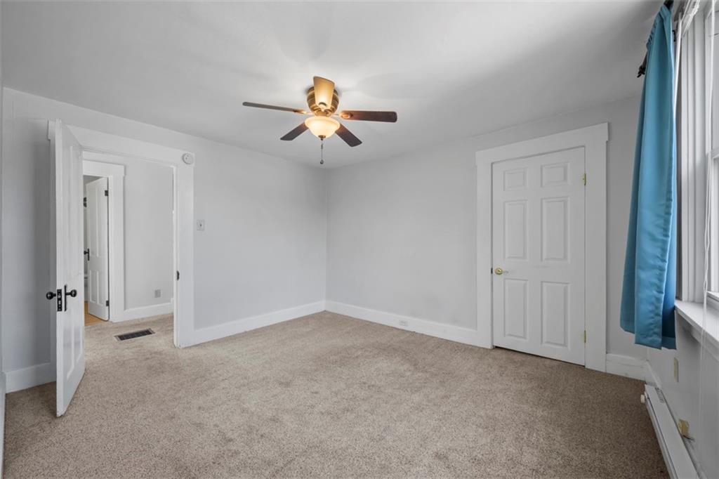 464 Franklin Street Slippery Rock, PA 16057 - Photo 34 of 45 an empty room with closet and a ceiling fan
