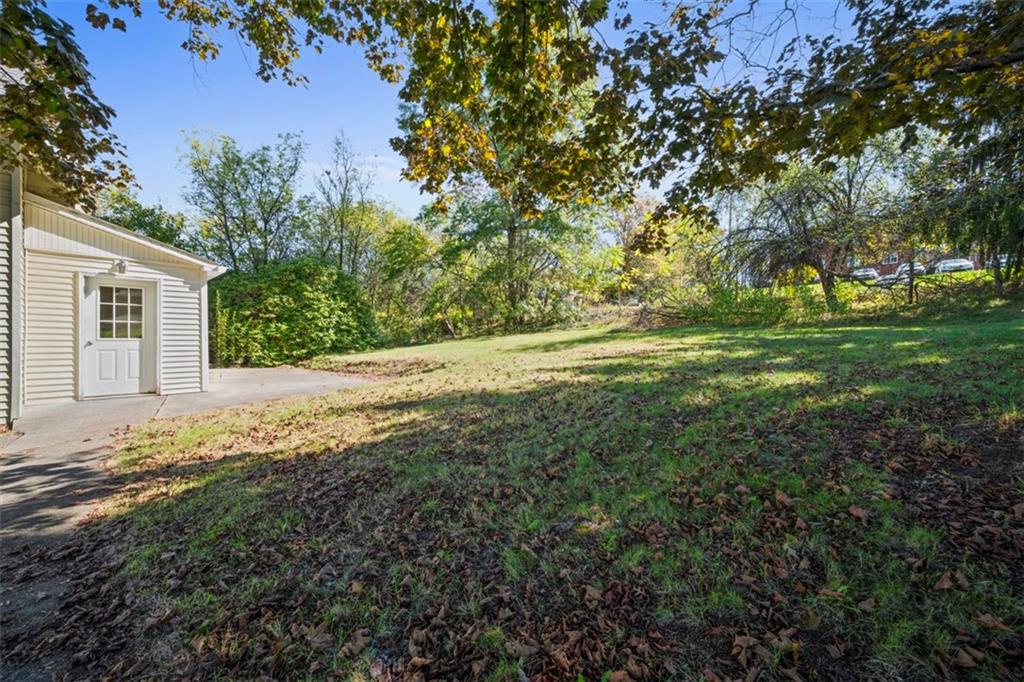 464 Franklin Street Slippery Rock, PA 16057 - Photo 39 of 45 a view of a yard with plants and large trees