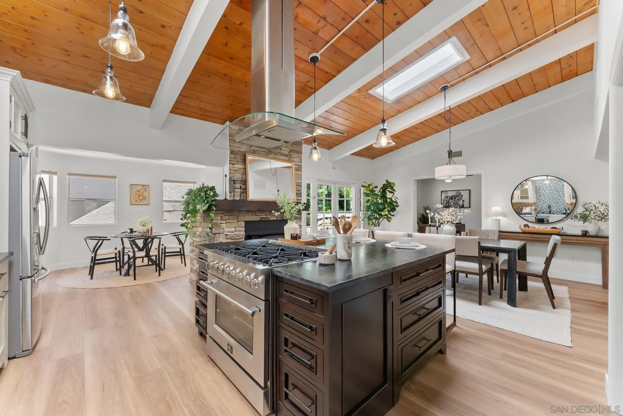 12832 Stone Canyon Road Poway, CA 92064 - Photo 7 of 60 a view of a kitchen with cabinets and wooden floor