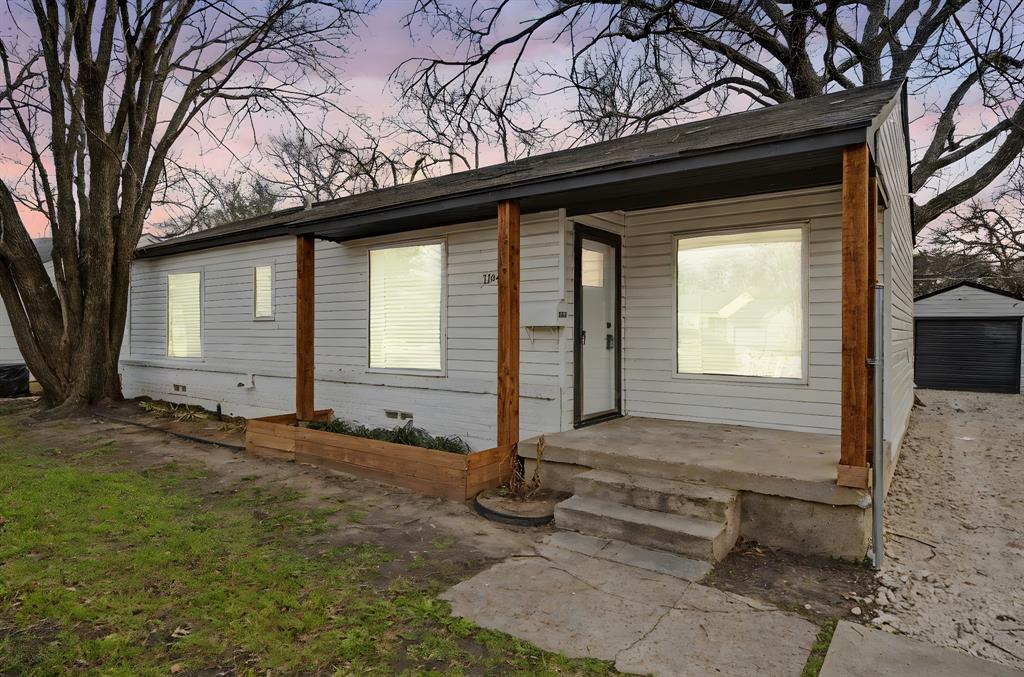 11446 Lippitt Avenue Dallas, TX 75218 - Photo 4 of 26 a front view of a house with garden