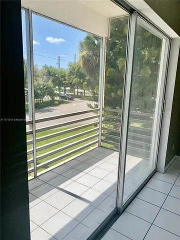 a view of a glass door and a window