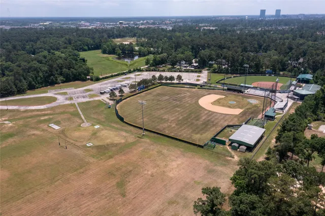 a view of a swimming pool with a yard and mountain view