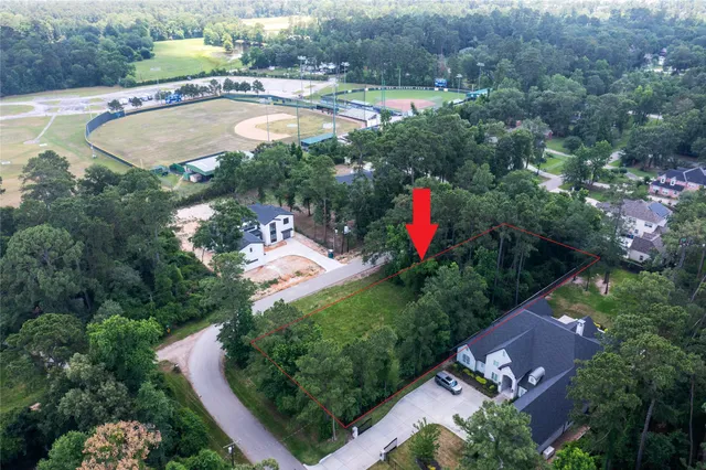 an aerial view of a house with a swimming pool yard and outdoor seating