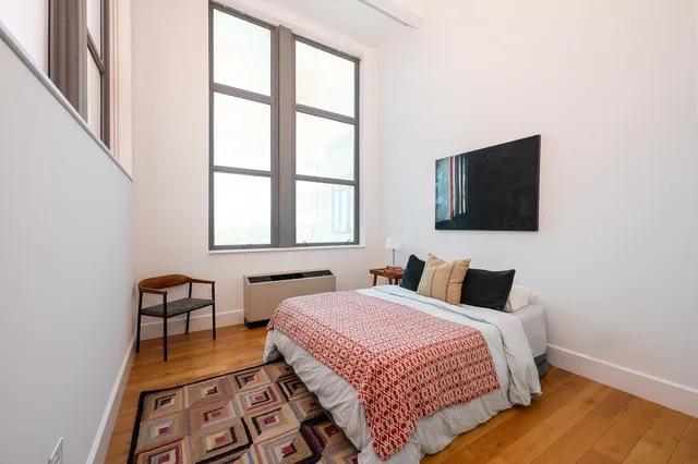 a bathroom with a double vanity sink mirror and toilet