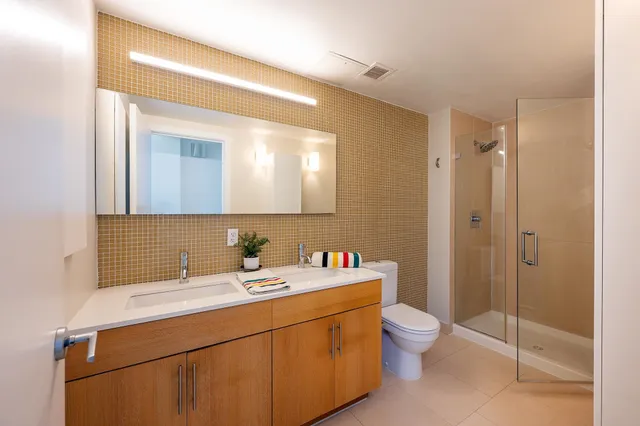 a bathroom with a toilet a sink and bathtub