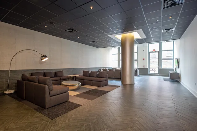 a view of a patio with table and chairs
