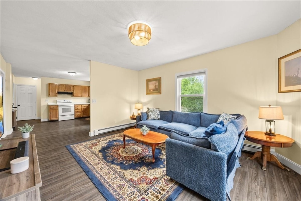 35 Hazel Street, Unit B Attleboro, MA 02703 - Photo 19 of 21 a living room with furniture and a wooden floor