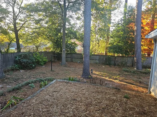 a backyard of a house with lots of green space