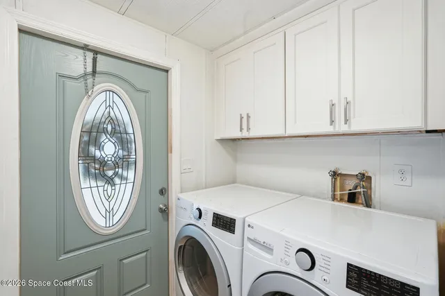 a kitchen with stainless steel appliances granite countertop a sink a stove and cabinets