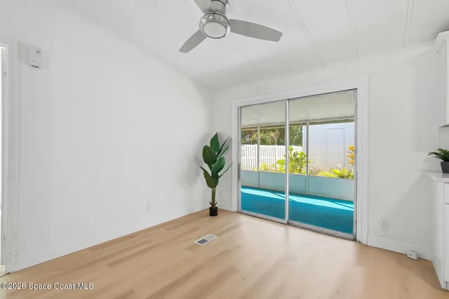 a view of kitchen with refrigerator microwave and stove top oven