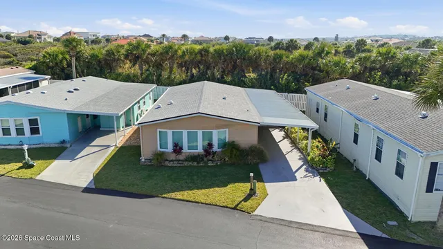an aerial view of a house with swimming pool