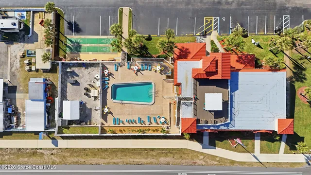 an aerial view of a house with a outdoor space