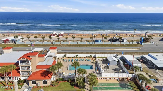 an aerial view of a house with a garden