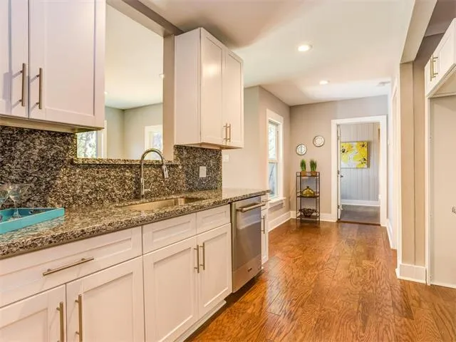a view of a dining room with furniture and a potted plant
