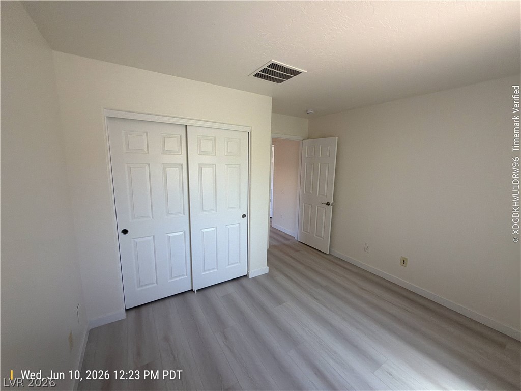 2388 Rue Bienville Way Henderson, NV 89044 - Photo 11 of 16 Functional bedroom featuring a neutral palette, a sizable closet, and durable flooring for versatile living.