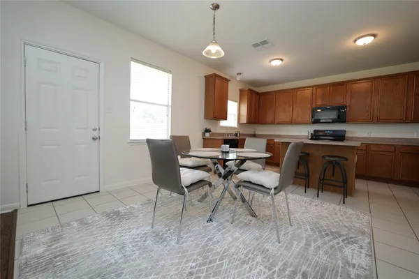 a kitchen with a cabinets and a stove top oven