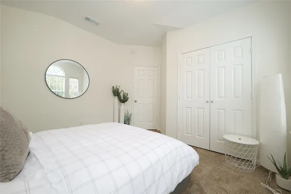 a living room with a bed furniture and a window