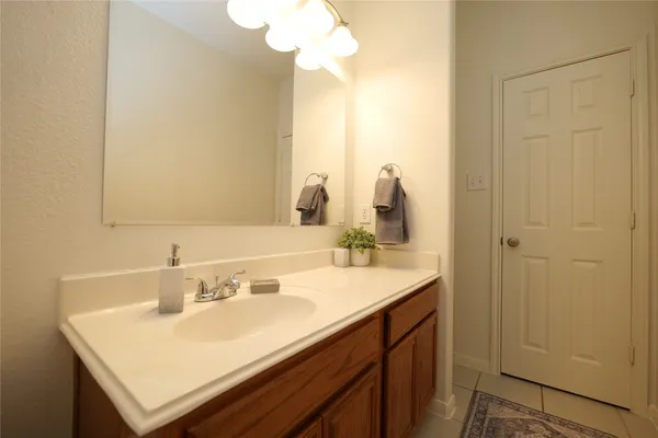 a bathroom with a sink a toilet and vanity