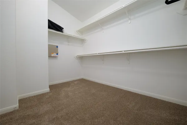 a view of a room with racks on the wall