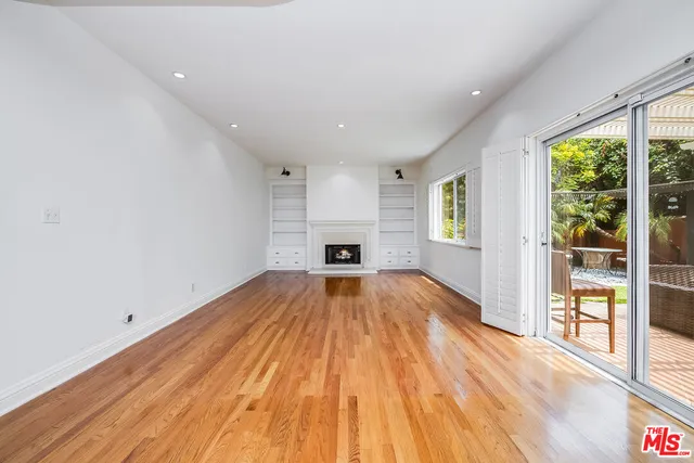 a view of hallway with wooden floor