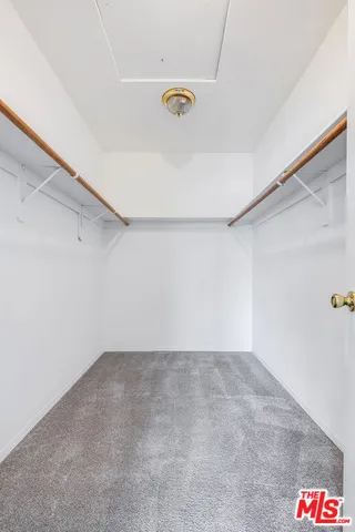 a spacious bathroom with a sink vanity and mirror