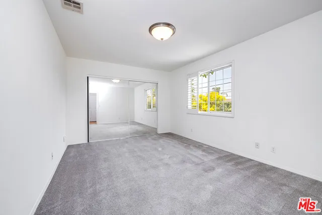 a bathroom with a double vanity sink toilet and shower