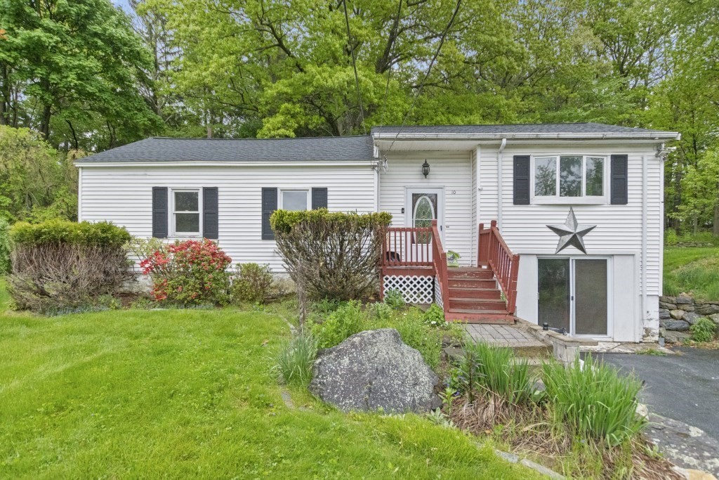 10 Marcius Road Worcester, MA 01607 - Photo 1 of 19 a view of a house with a yard and potted plants