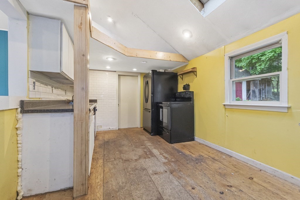 10 Marcius Road Worcester, MA 01607 - Photo 2 of 19 a view of a kitchen with wooden floor and a refrigerator