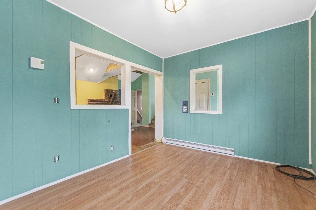 10 Marcius Road Worcester, MA 01607 - Photo 4 of 19 a view of empty room with window and wooden floor