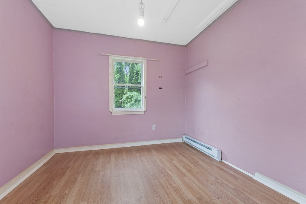 10 Marcius Road Worcester, MA 01607 - Photo 8 of 19 an empty room with wooden floor and windows