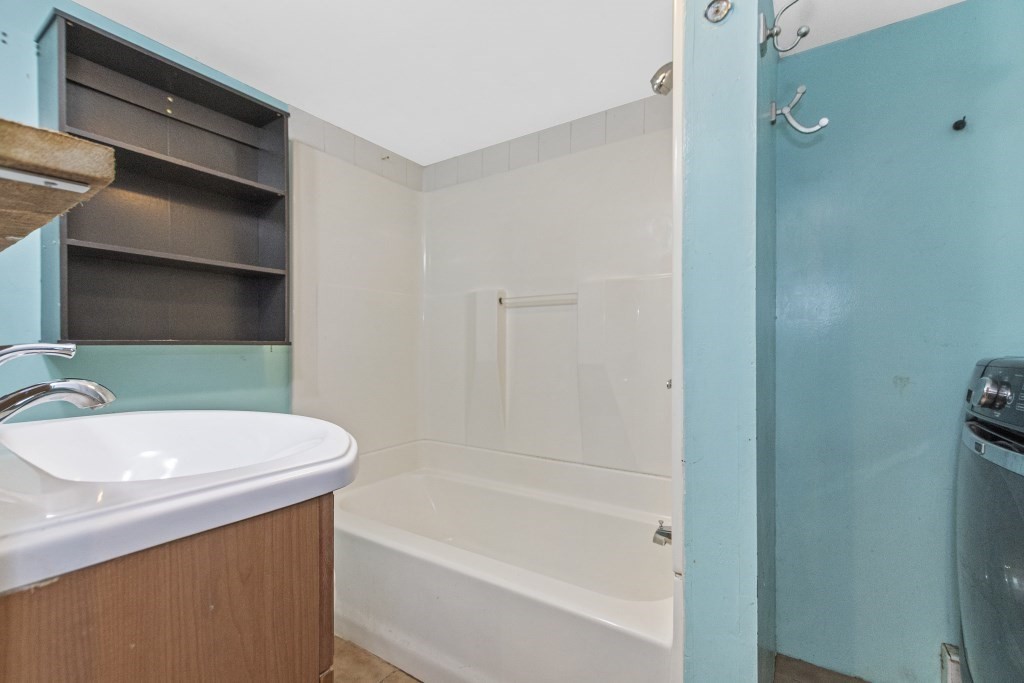 10 Marcius Road Worcester, MA 01607 - Photo 9 of 19 a bathroom with a sink a toilet and bathtub