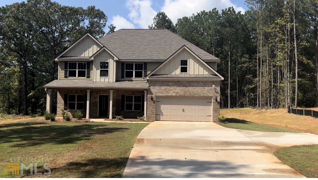 3500 Peeksville Road Locust Grove, GA 30248 - Photo 1 of 1 a front view of a house with a garden