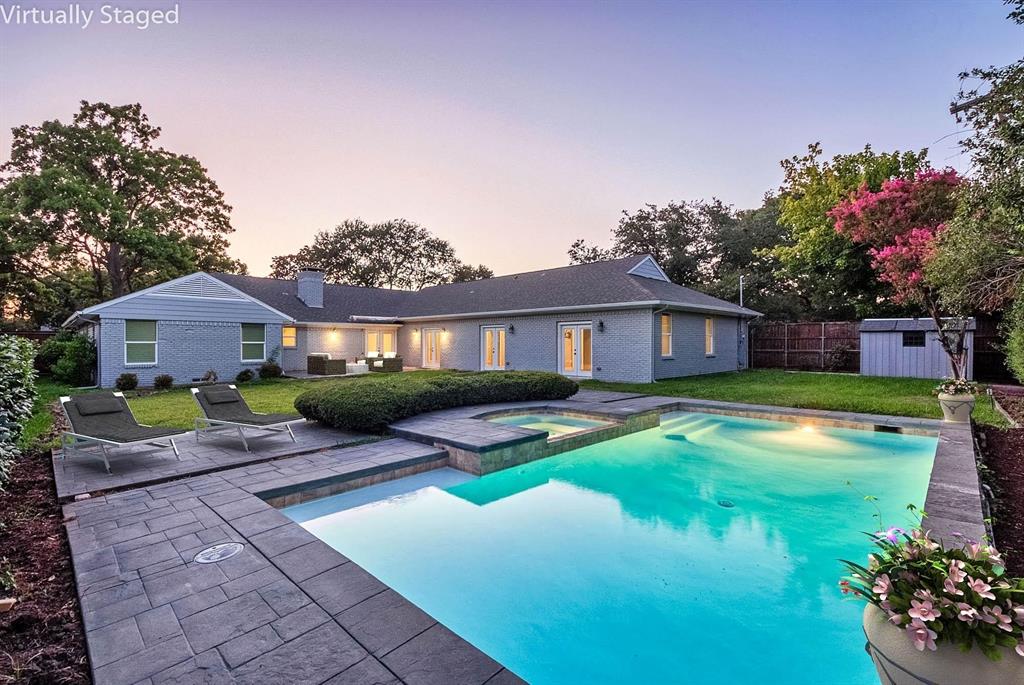11224 Jamestown Road Dallas, TX 75230 - Photo 1 of 40 a front view of house with yard and green space
