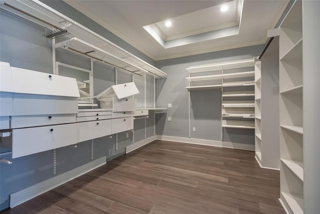 11224 Jamestown Road Dallas, TX 75230 - Photo 23 of 40 a view of walk in closet with empty racks