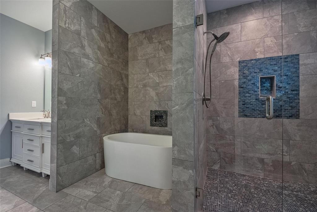 11224 Jamestown Road Dallas, TX 75230 - Photo 25 of 40 a bathroom with a toilet and a shower
