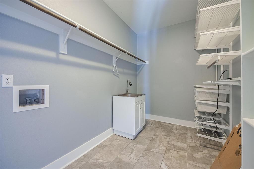 11224 Jamestown Road Dallas, TX 75230 - Photo 32 of 40 a view of a room with racks on the wall