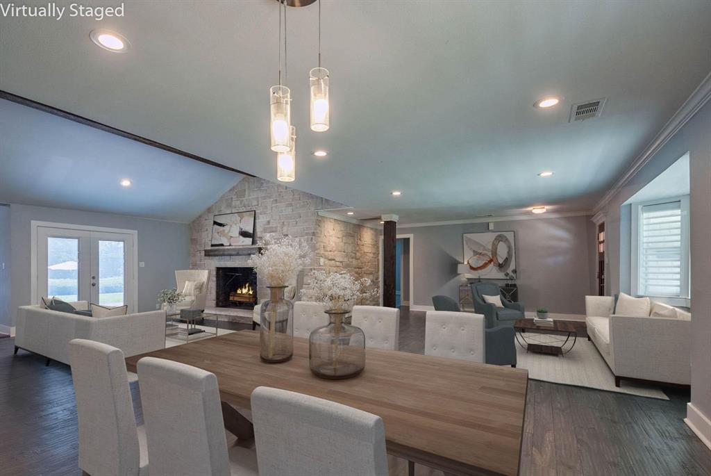 11224 Jamestown Road Dallas, TX 75230 - Photo 5 of 40 a living room with fireplace furniture and a wooden floor