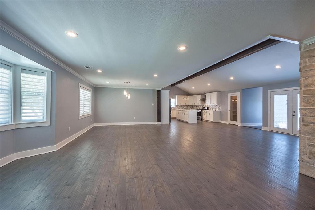 11224 Jamestown Road Dallas, TX 75230 - Photo 9 of 40 a view of empty room with wooden floor and windows