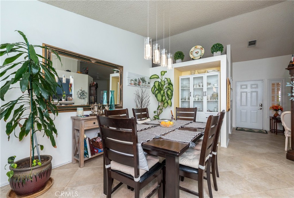 26592 Braddock Road Menifee, CA 92586 - Photo 12 of 25 a view of a dining room with furniture and window